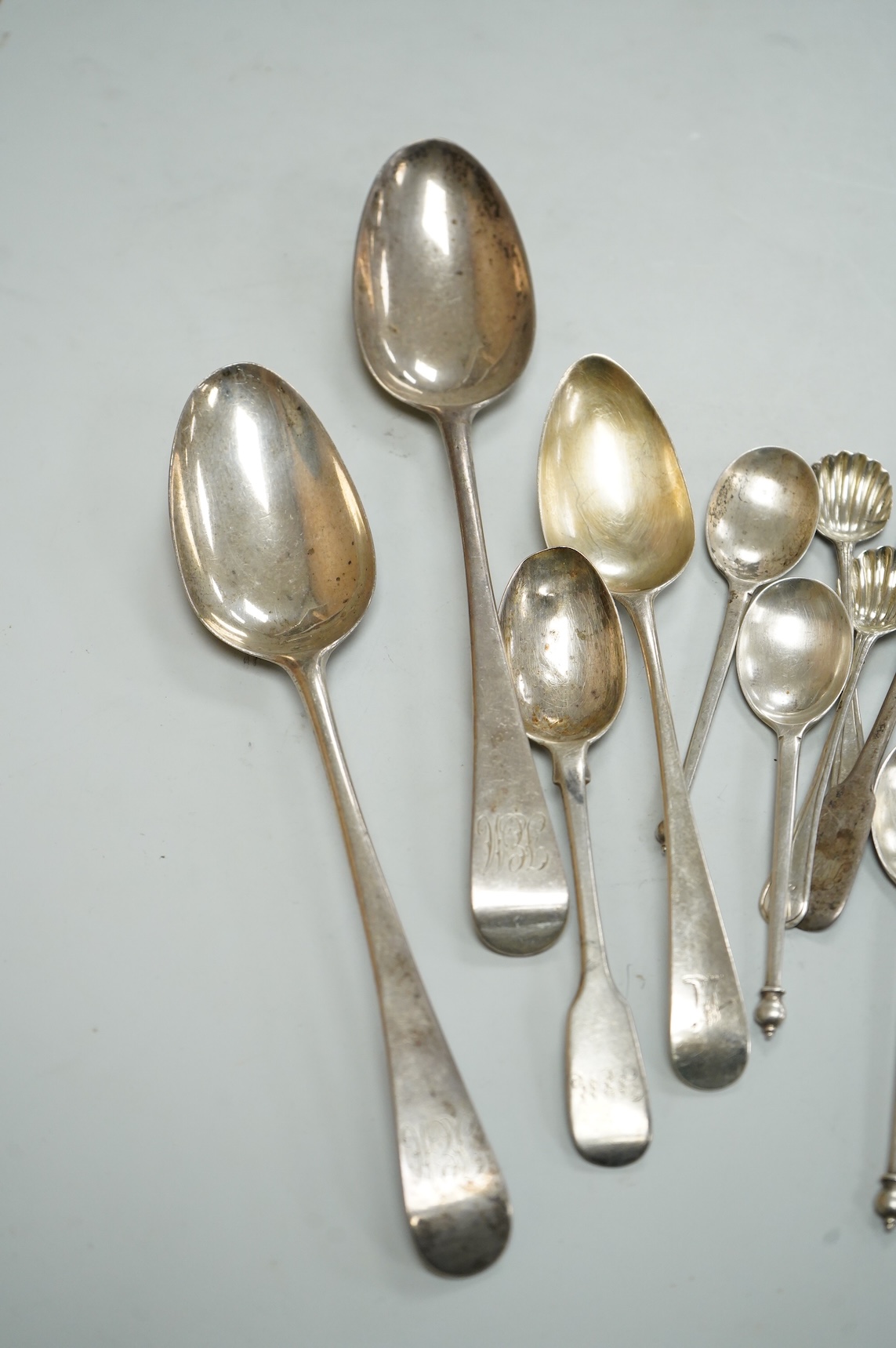 A collection of assorted 19th century and later silver flatware, including two George III table spoons, London, 1808 and 1804, various pattern, dates and makers, 13.1oz.